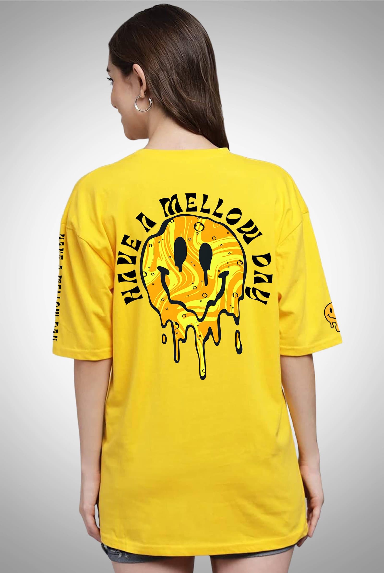 Bright yellow oversized t-shirt with a melting smiley and 'Have a Mellow Day' on the back
