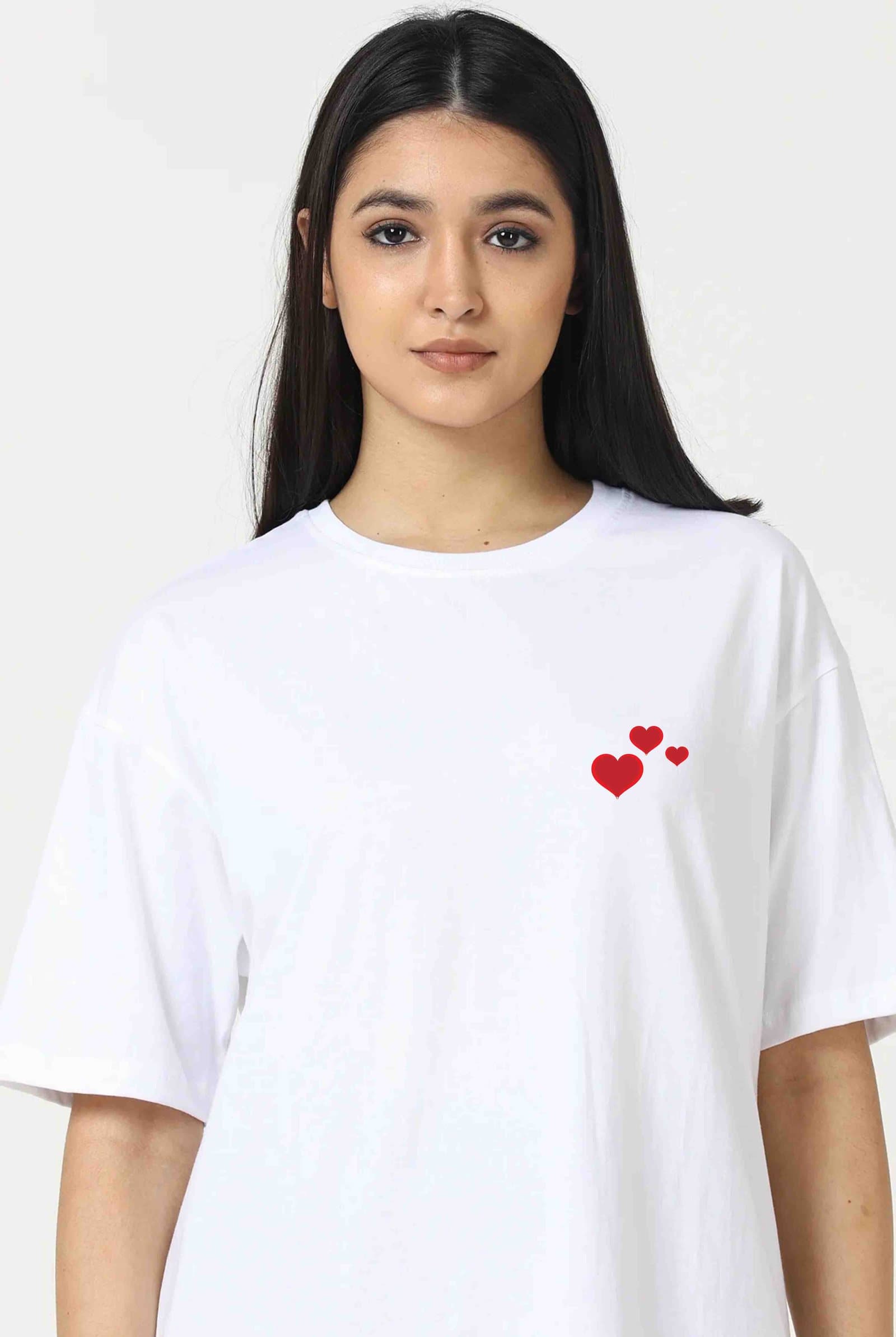White t-shirt with a small red hearts print on the chest